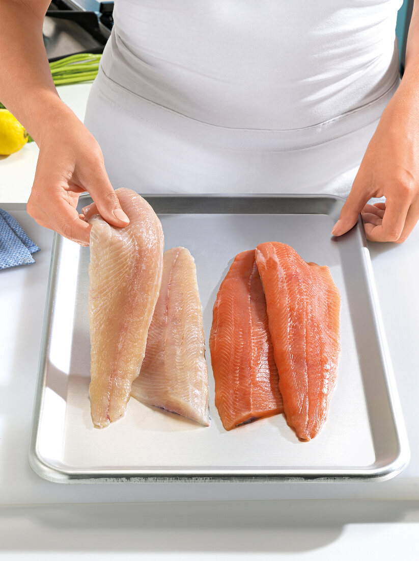 Raw fish fillet on tray