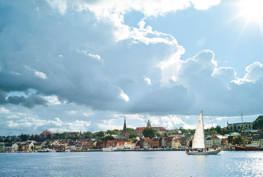 View of Flensburg shore boats with cloudy sky, Baltic Sea coast