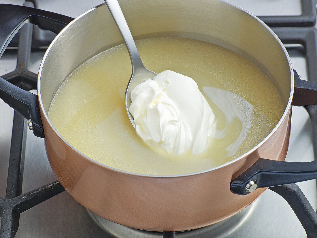 Cream being added in creme fraiche for double binding, step 1