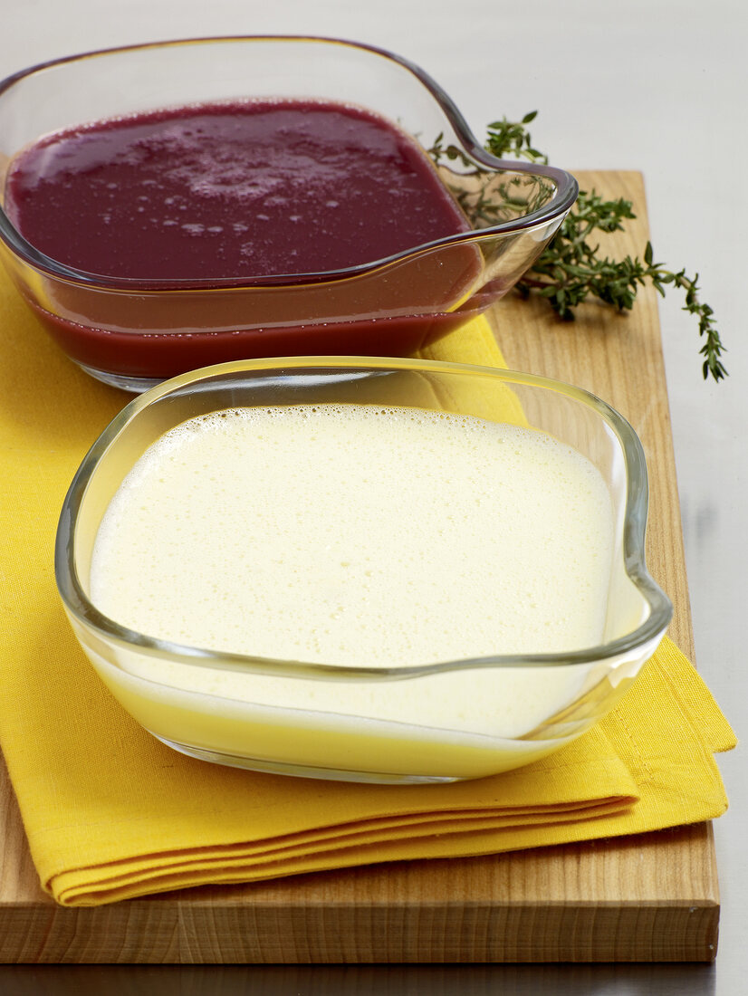 Red and white butter sauce in glass bowl