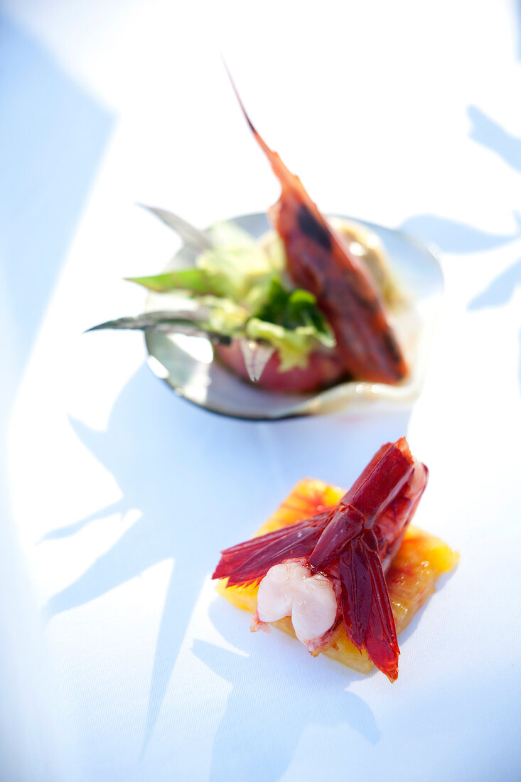 Carabinero shrimp with pineapple and tomato carpaccio on plate