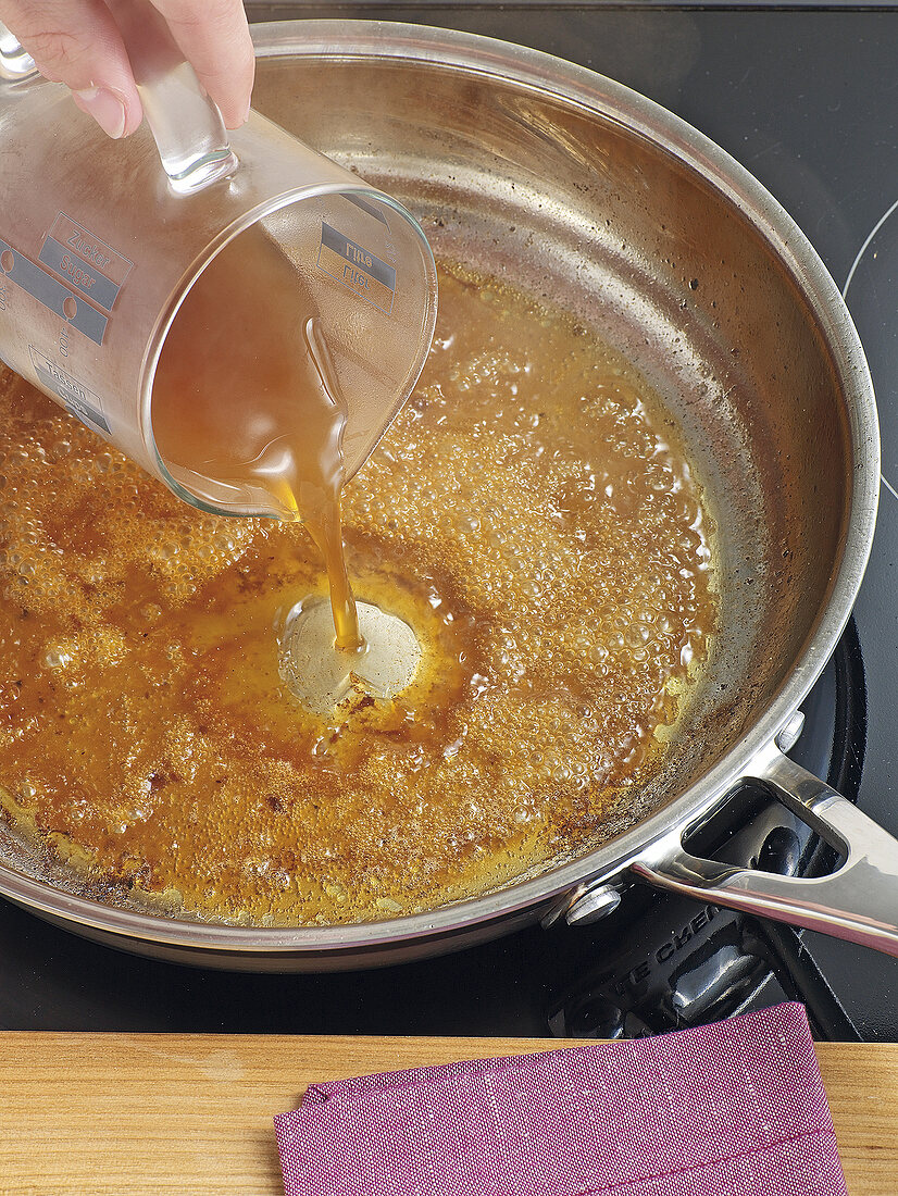 Pepper sauce being poured in saucepan, step 2