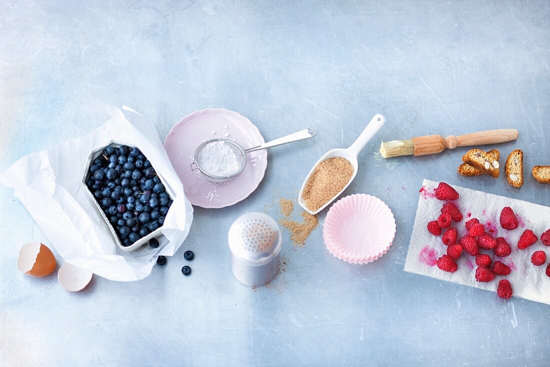 An arrangement of ingredients for berry muffins