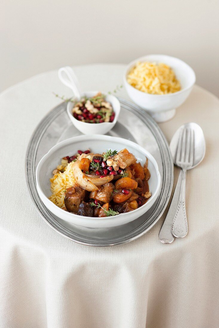 Aubergine ragout with apricots and pomegranate seeds on rice (Arabia)