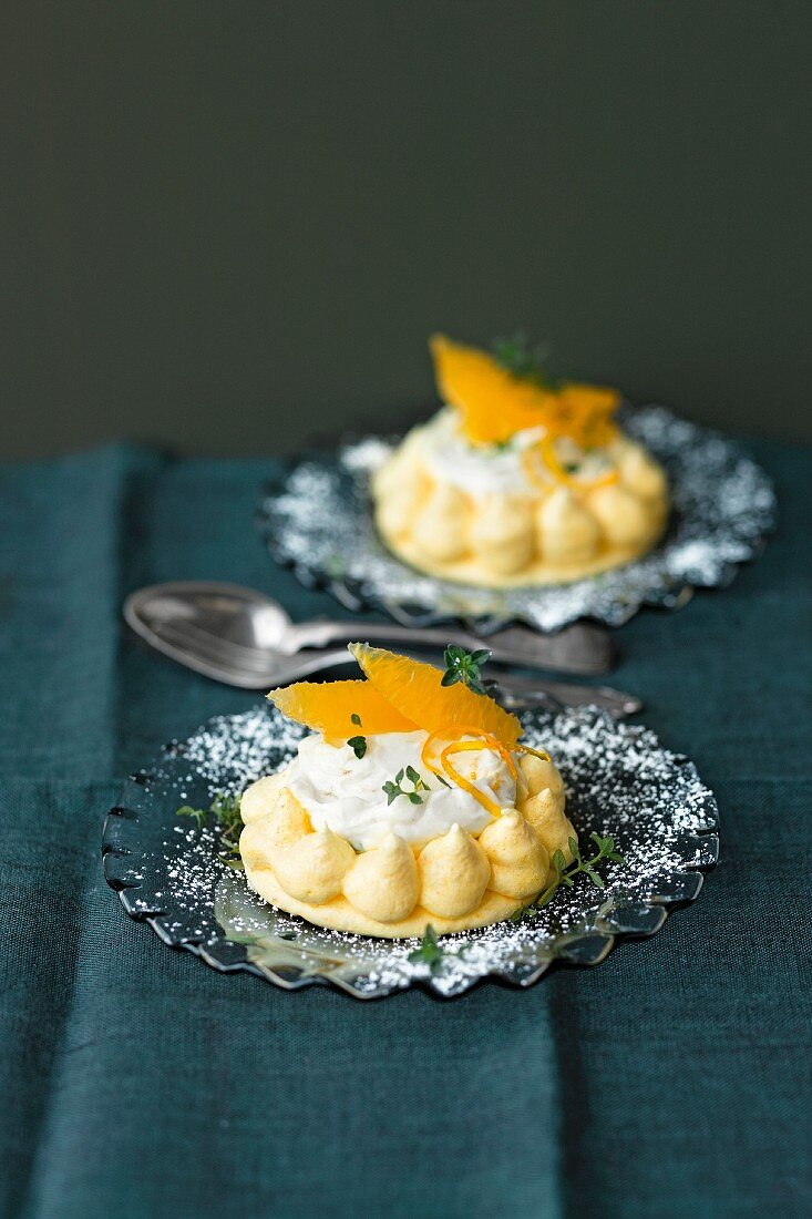 Saffron meringues filled with cream cheese and orange fillets