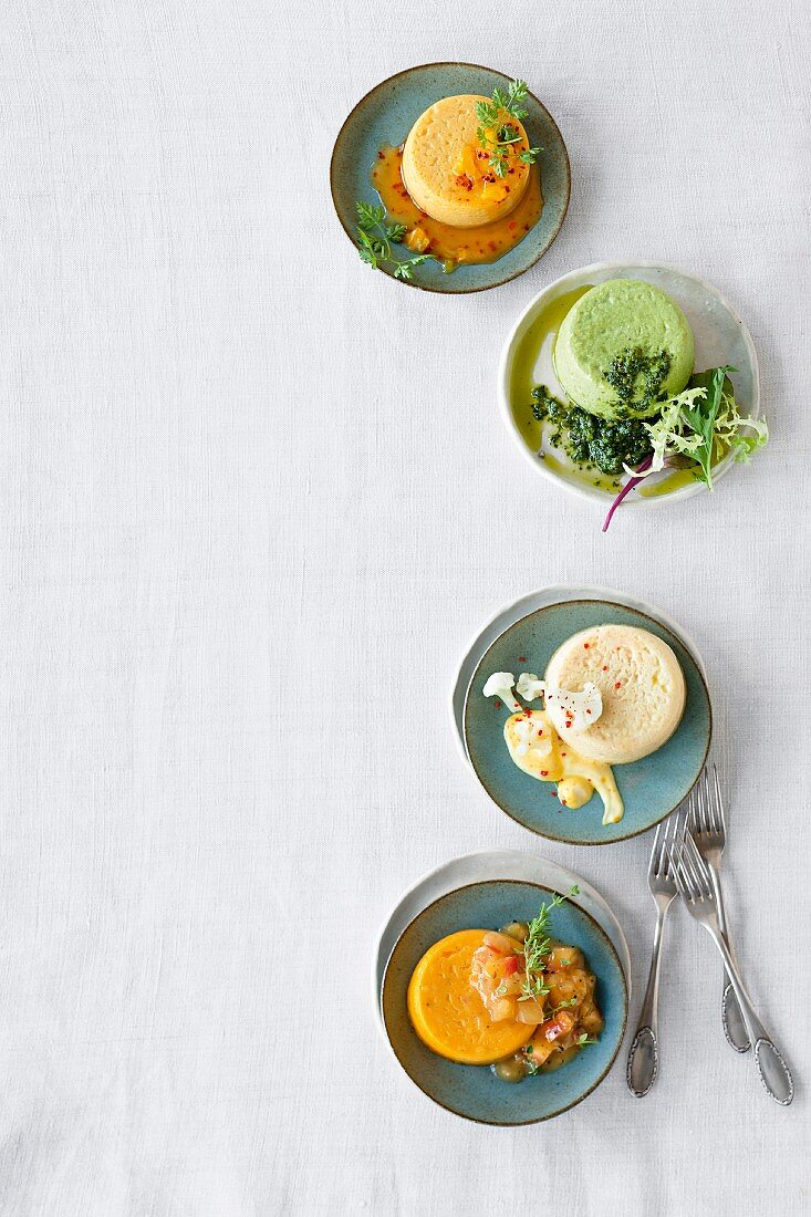 Four different vegetarian flans (seen from above)