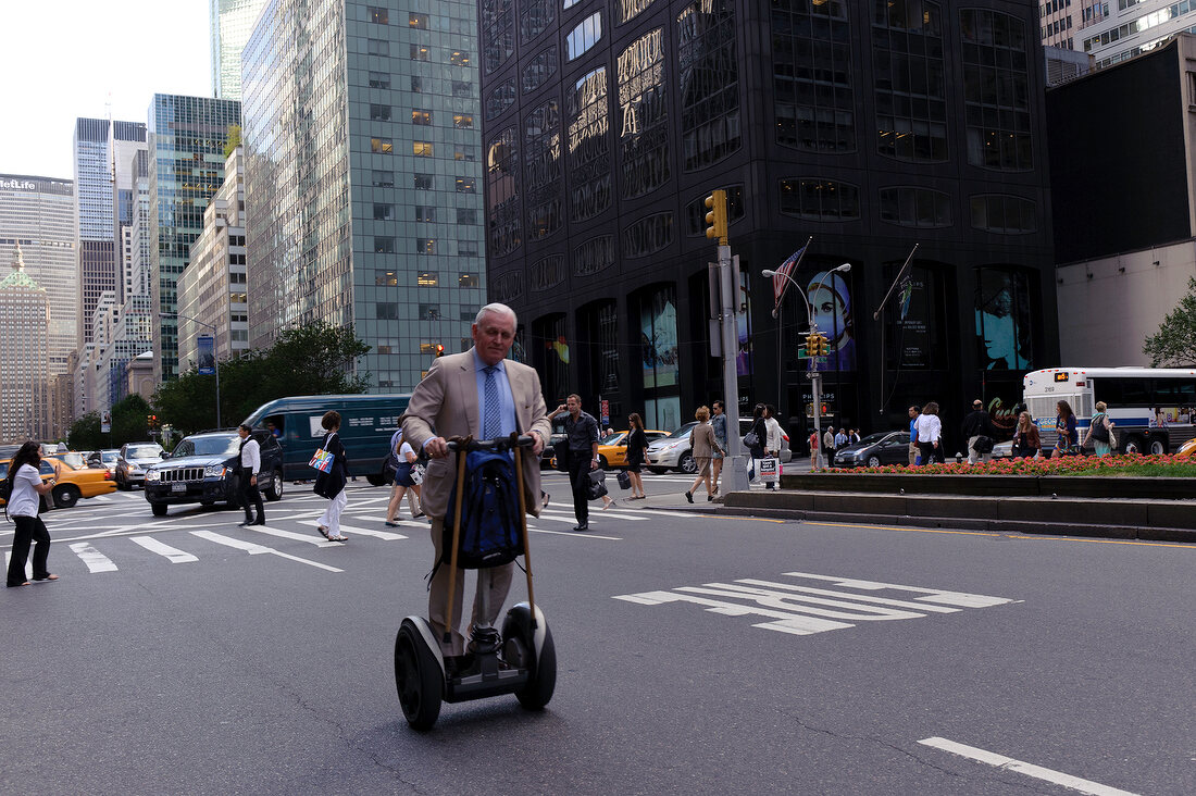 Man riding two wheeled electric bike on Segway Park Avenue, New York