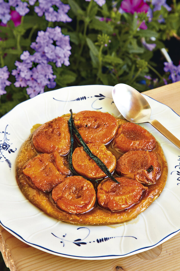 Tarte tatin with apricots on plate