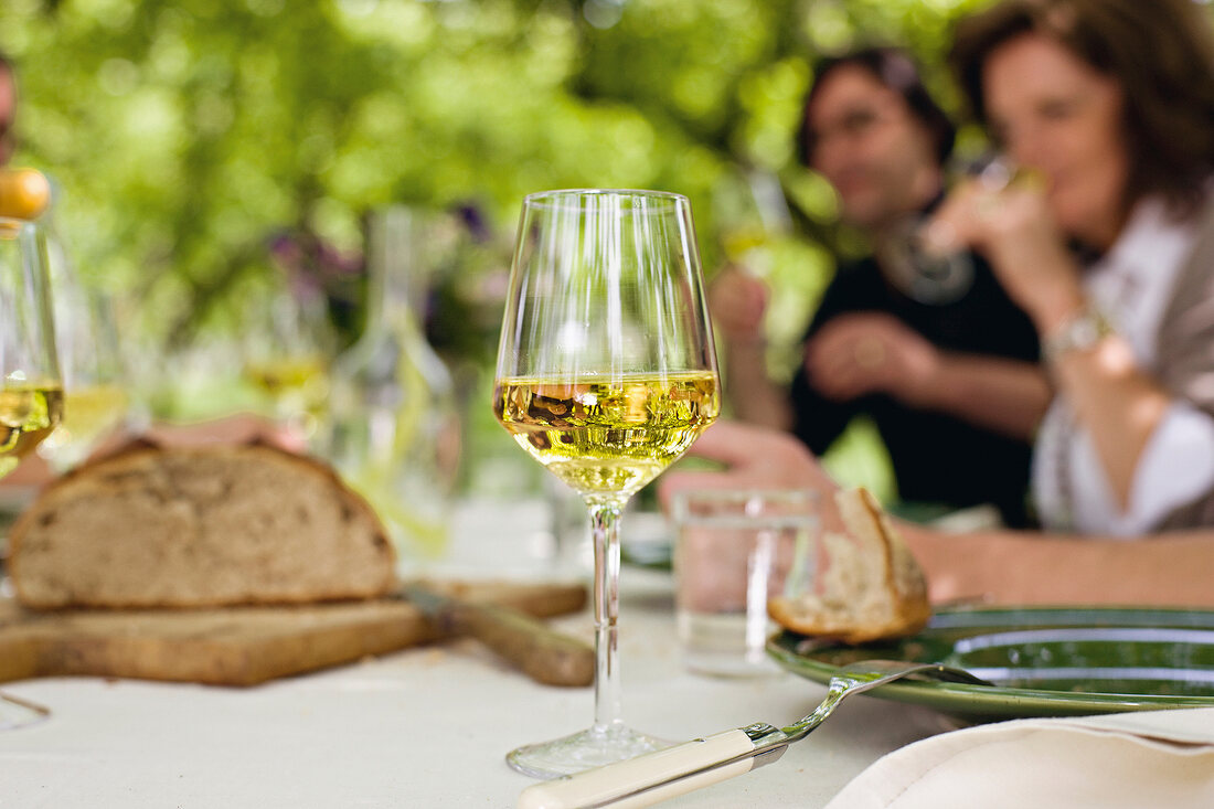 Glass of white wine on table, close-up