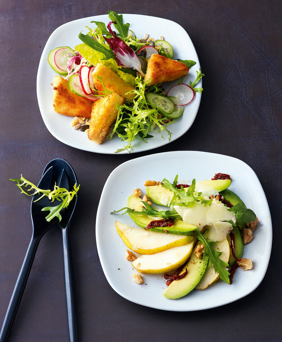 Feta cheese, lettuce and avocado with pear salad on plate