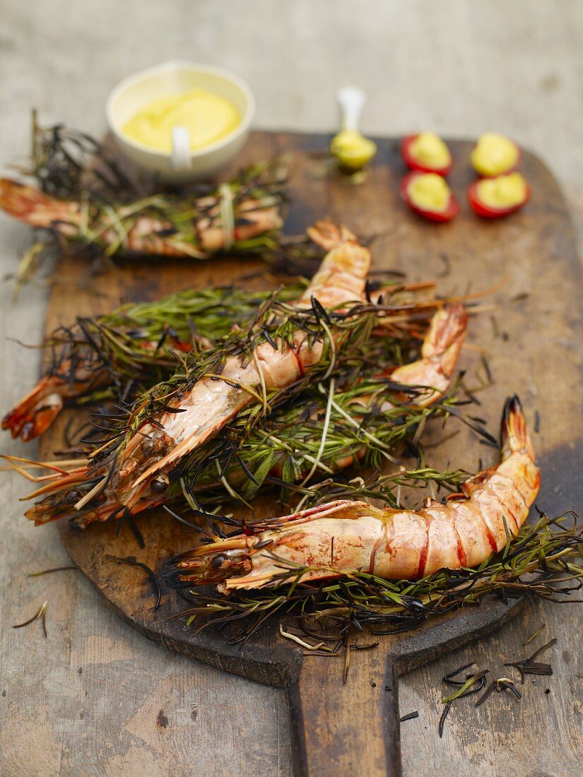 Prawns wrapped with rosemary, and tomatoes with saffron mayonnaise