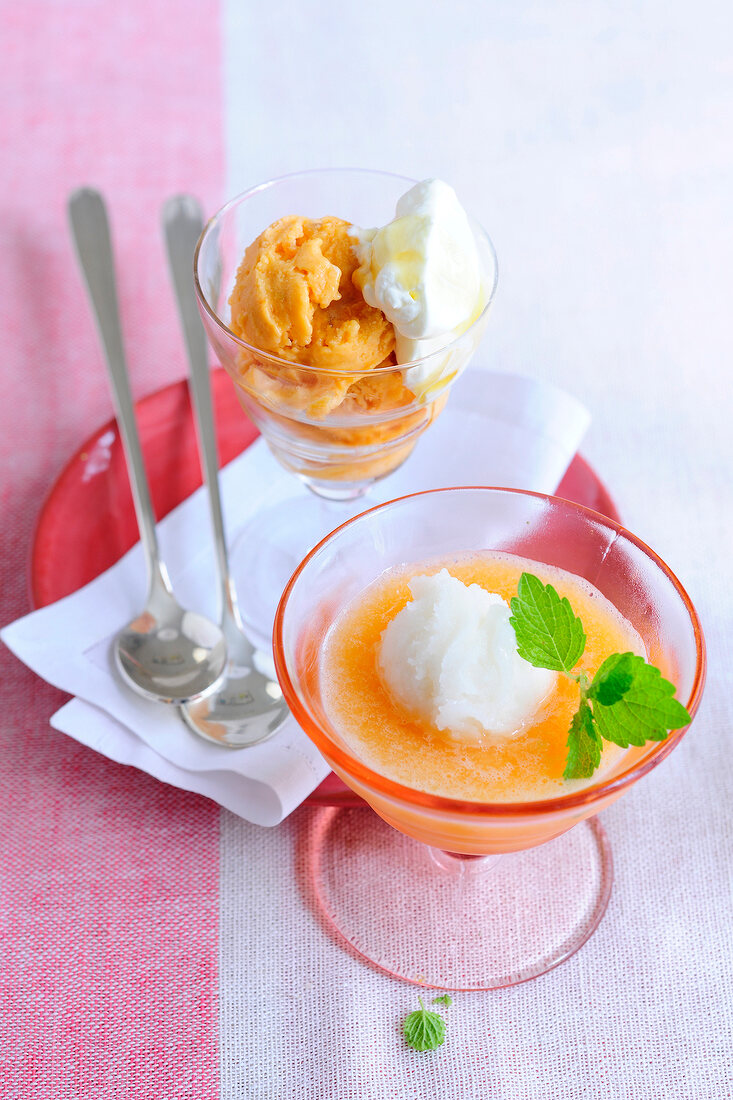 Iced peach and melon soup in bowl and apricot with amarett in glass