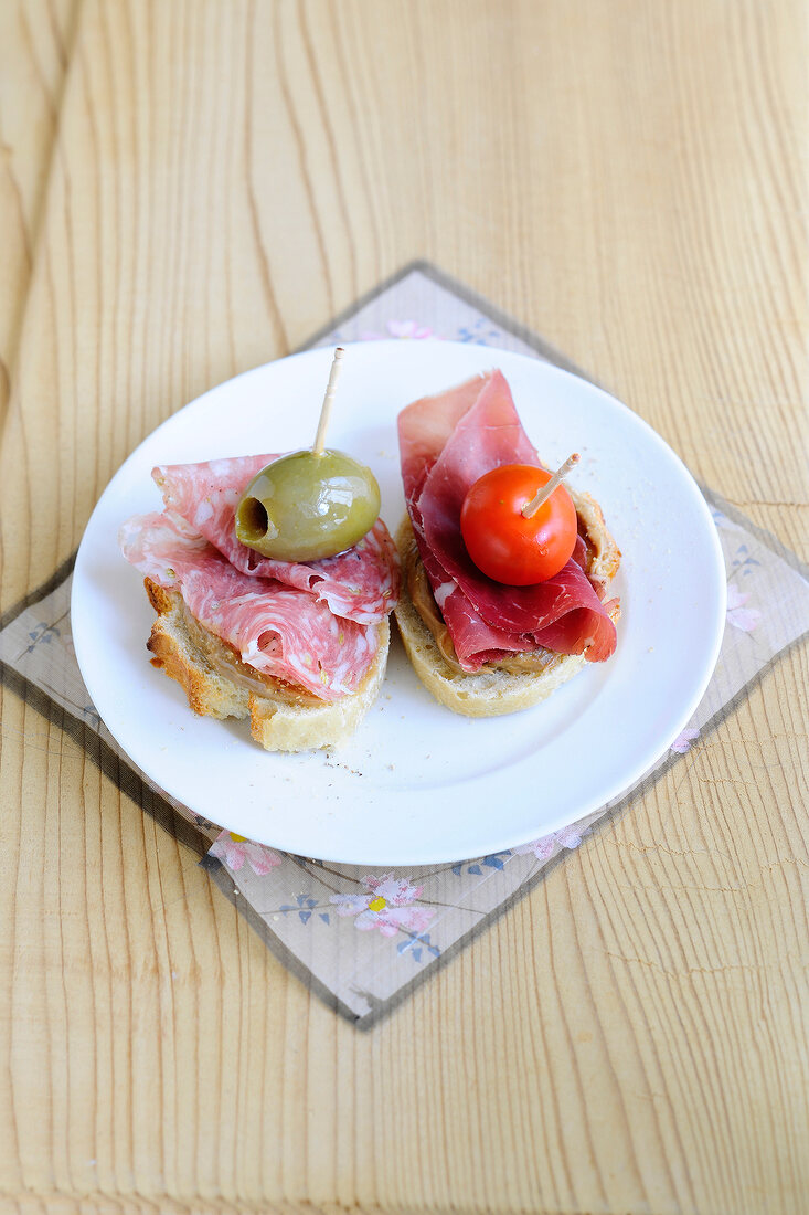Salami canapes on plate