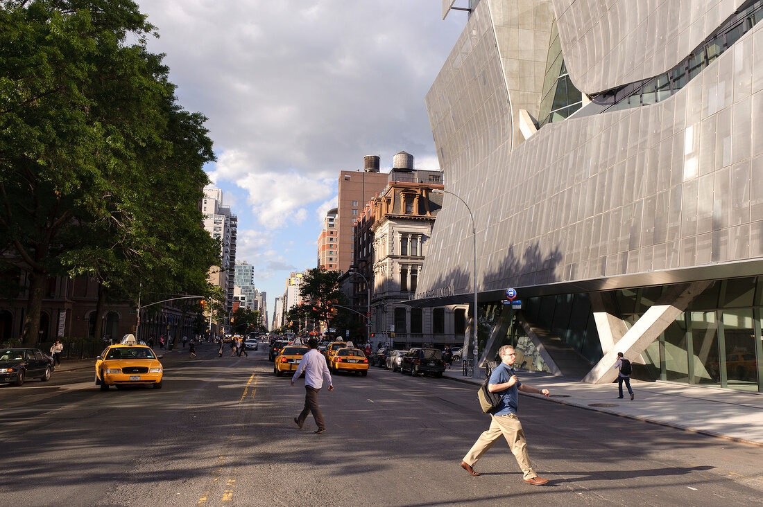 People crossing road at East Village near Cooper Union, New York, USA