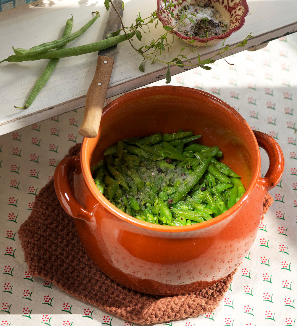 Close-up of green beans in clay pot