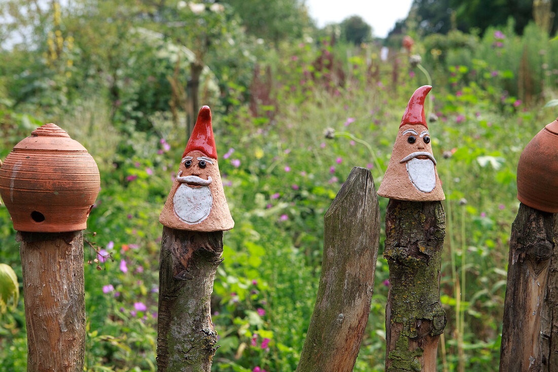 Clay pots on wooden post in garden at Baltic coast, Schleswig-Holstein
