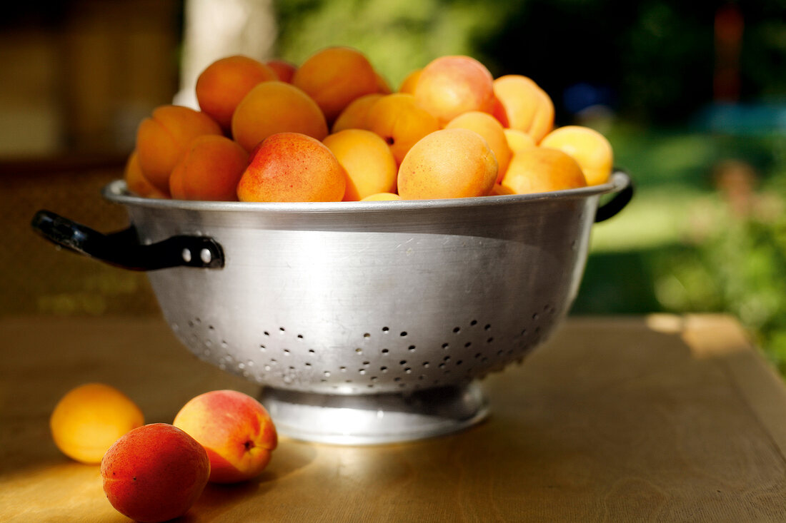 Fresh apricots in colander