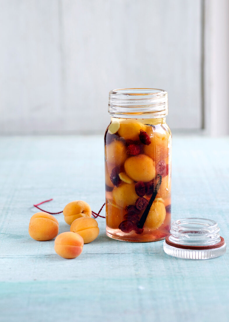 Close-up of apricot brandy in jar