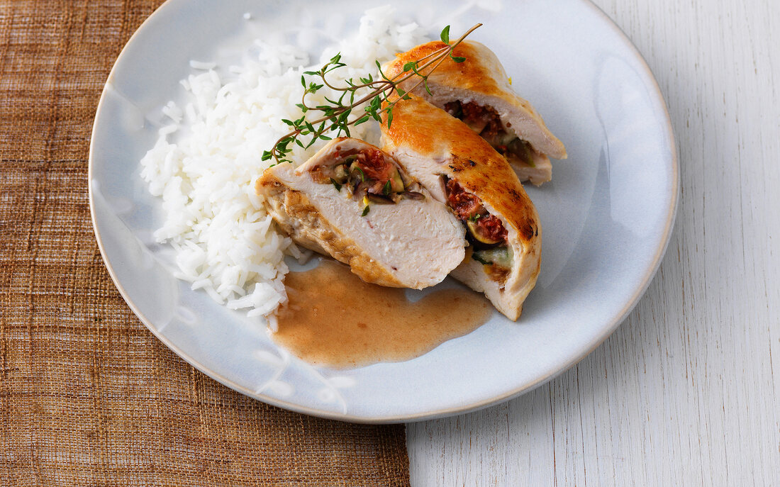 Chicken breast fillet with figs and mozzarella filling served with rice