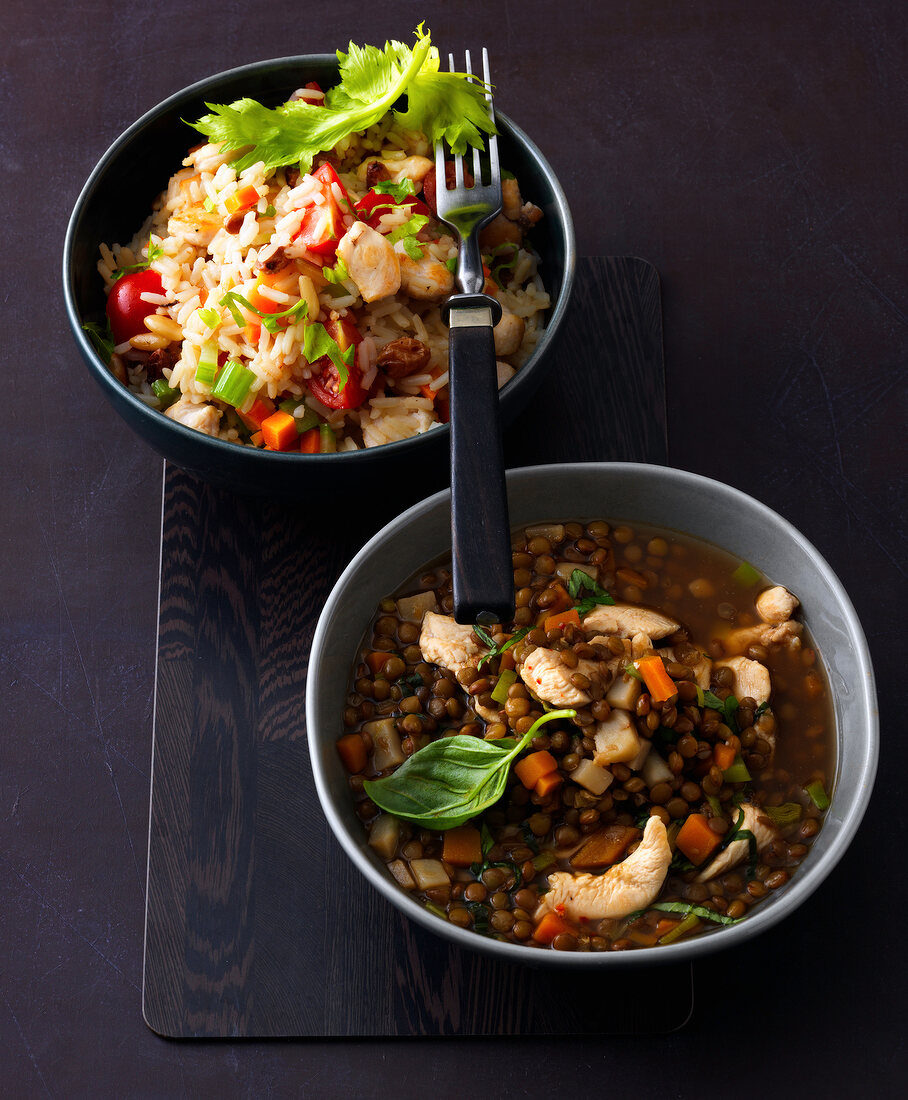 Two bowls with chicken pilaf and chicken lentil stew