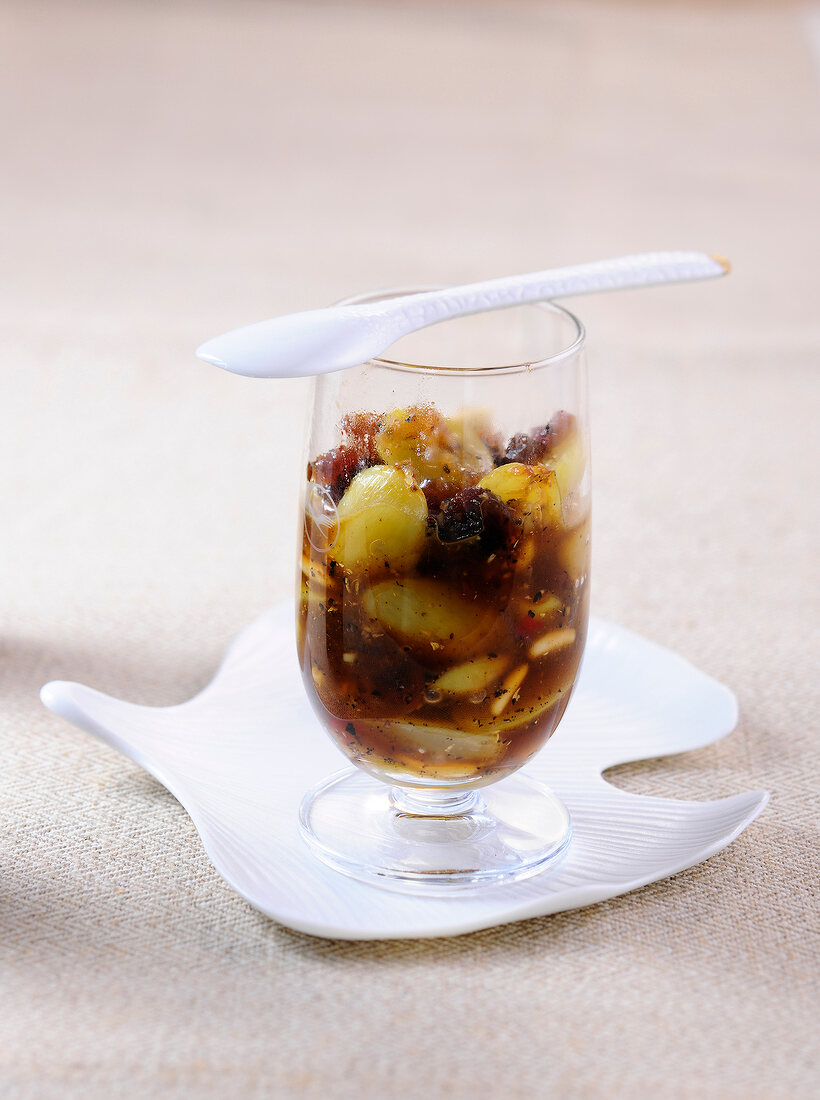 Grape chutney with pine nuts in glass