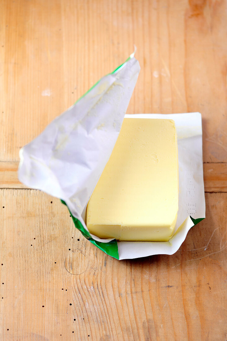 Close-up of butter on wooden board