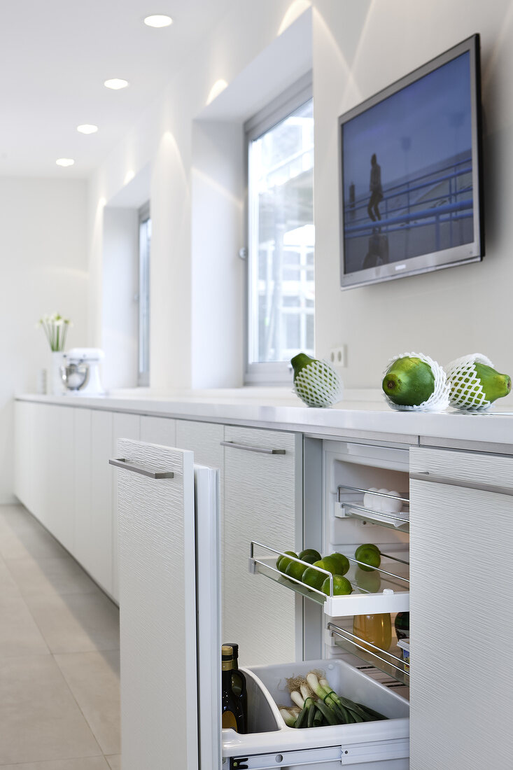 Fruits in drawer of white cabinet