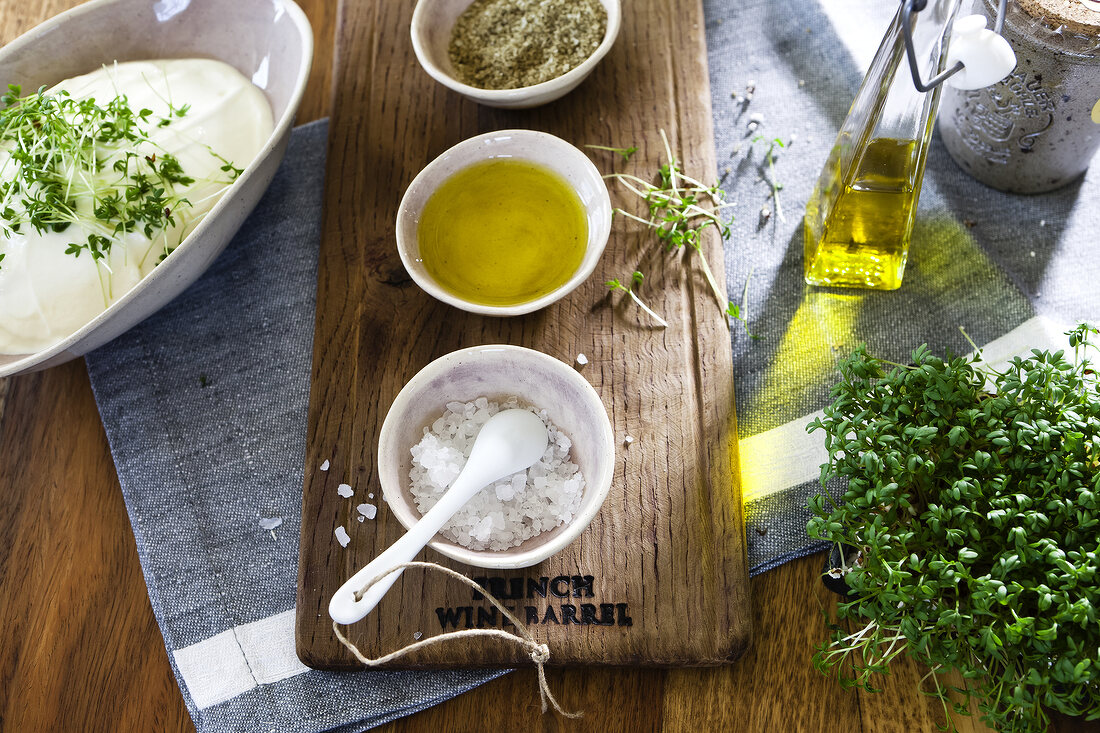 Coarse sea salt and oil in bowls