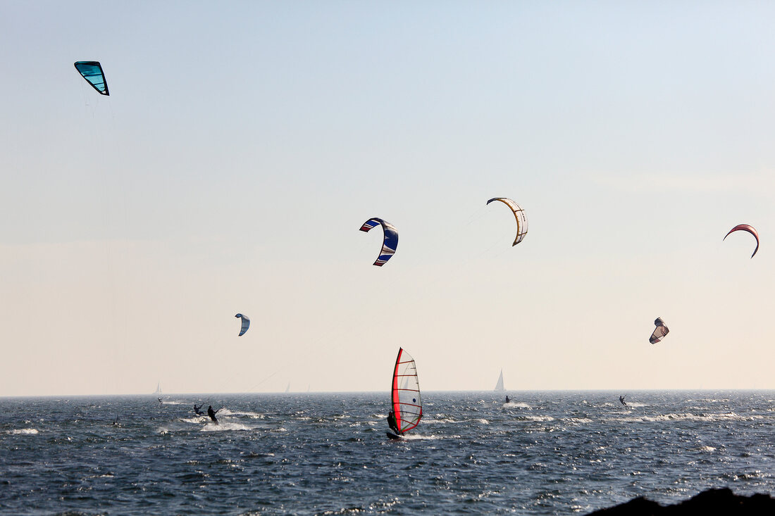 Kitesurfer doing kite surfing an Baltic Sea Coast in Fehmarn, Ostholstein, Germany 