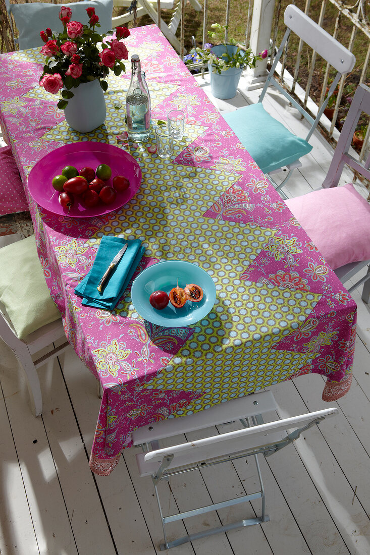 Elevated view of garden table and chairs with handmade tablecloth