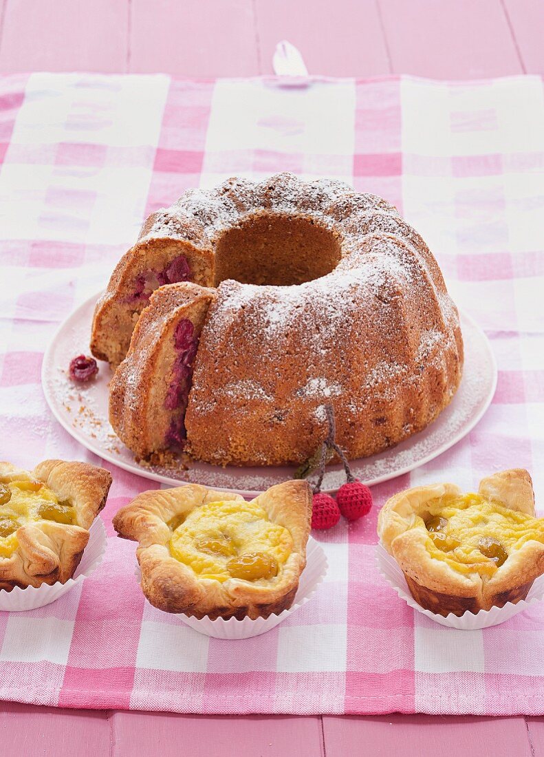 An almond Bundt cake with cherries and mirabelle tartlets
