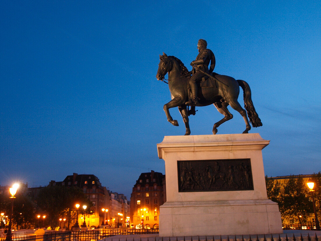 Statue at dusk in Seine Pont Neuf, Paris, France