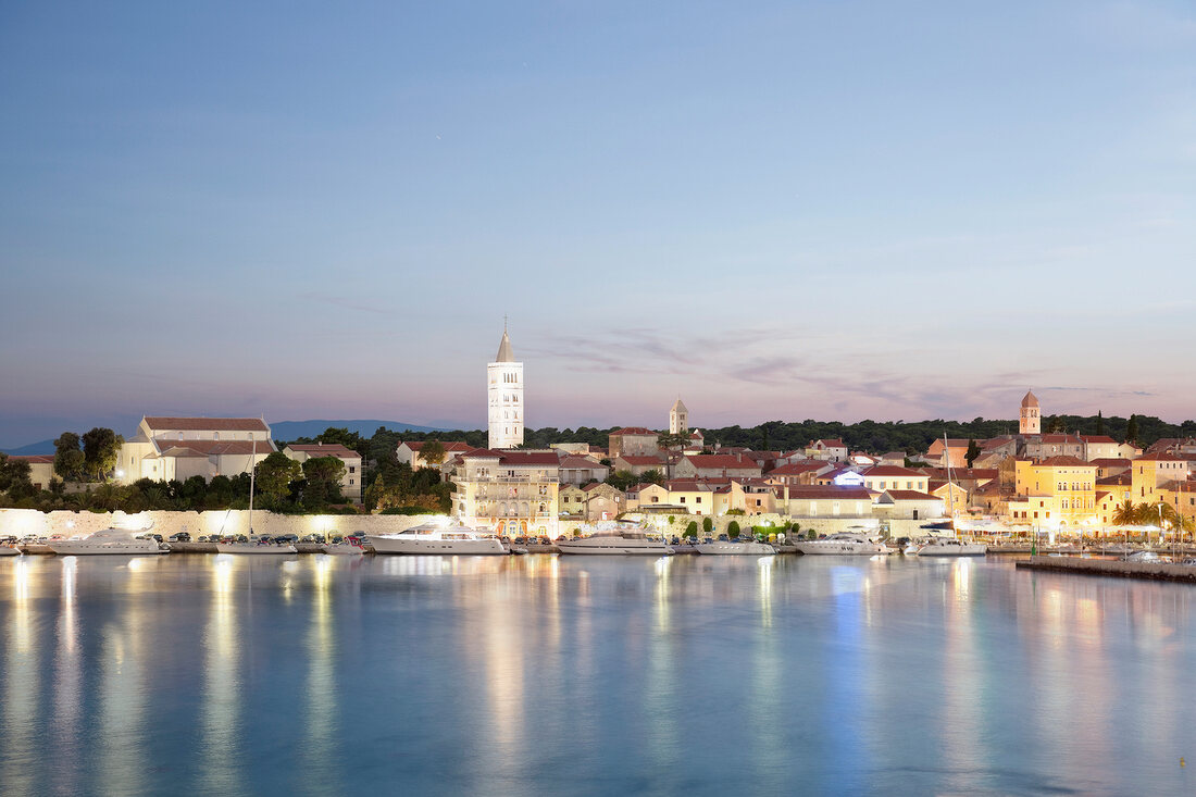 View of Rab cityscape and Adriatic sea at dusk in Croatia