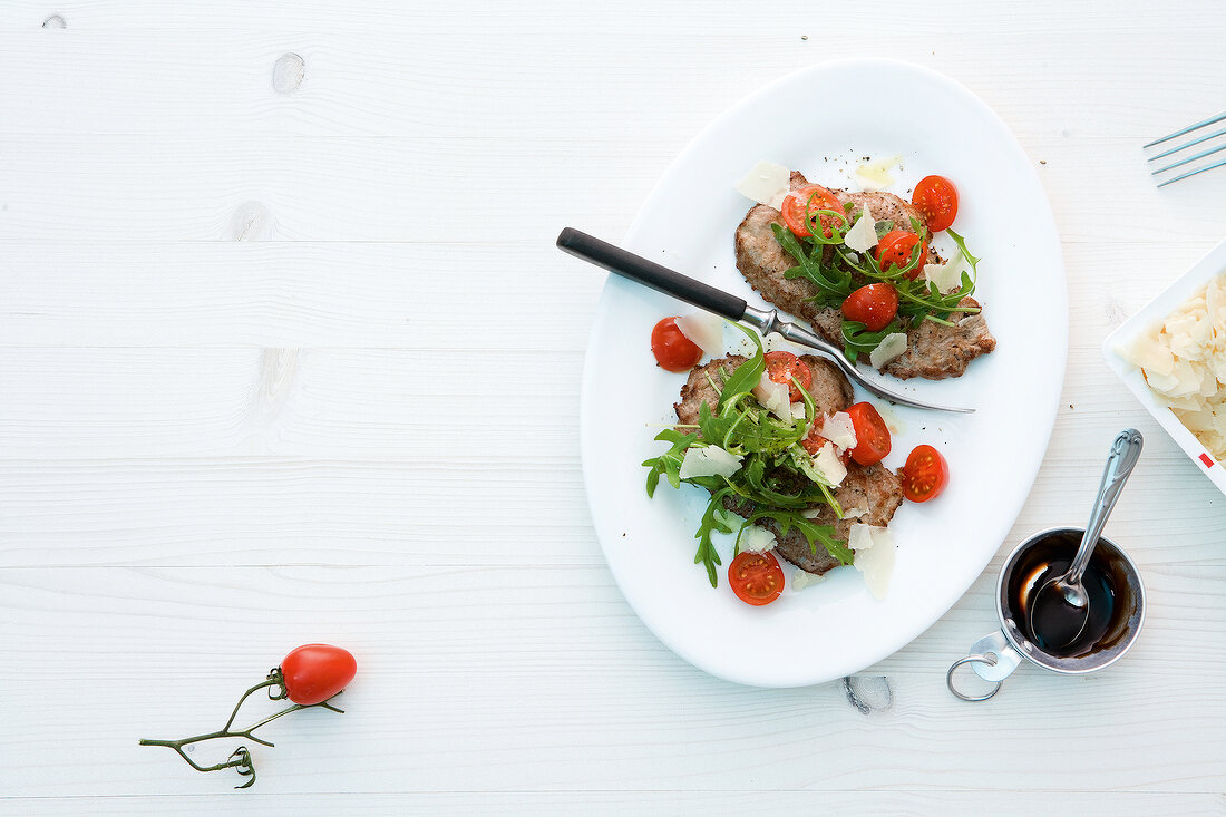 Palermo schnitzel in serving dish on white background