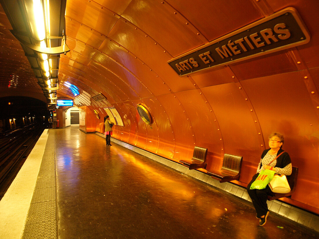 Senior woman waiting at Arts et Metiers metro station in Paris, France