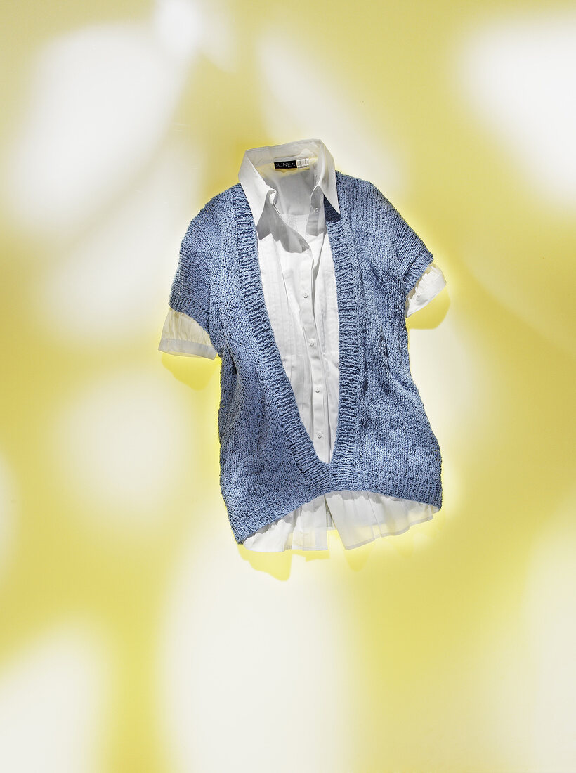 Knitted tank top with v-neck on yellow background