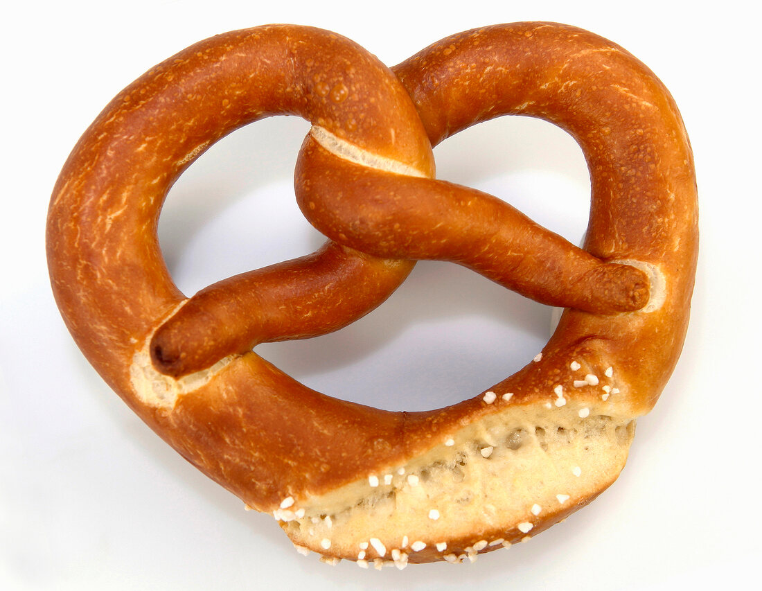 Whole grain pretzels on white background