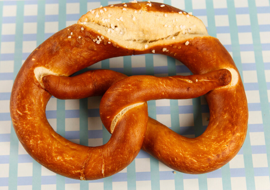 Pretzel cut at edge on white background