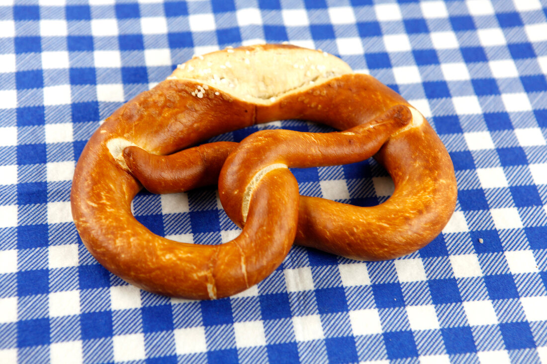 Pretzel cut at edge on checked napkin