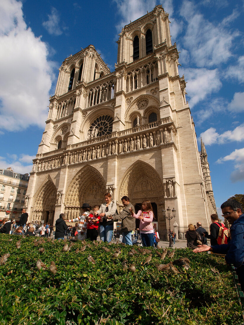 View of tourists outside Notre-Dame Cathedral in Paris, France