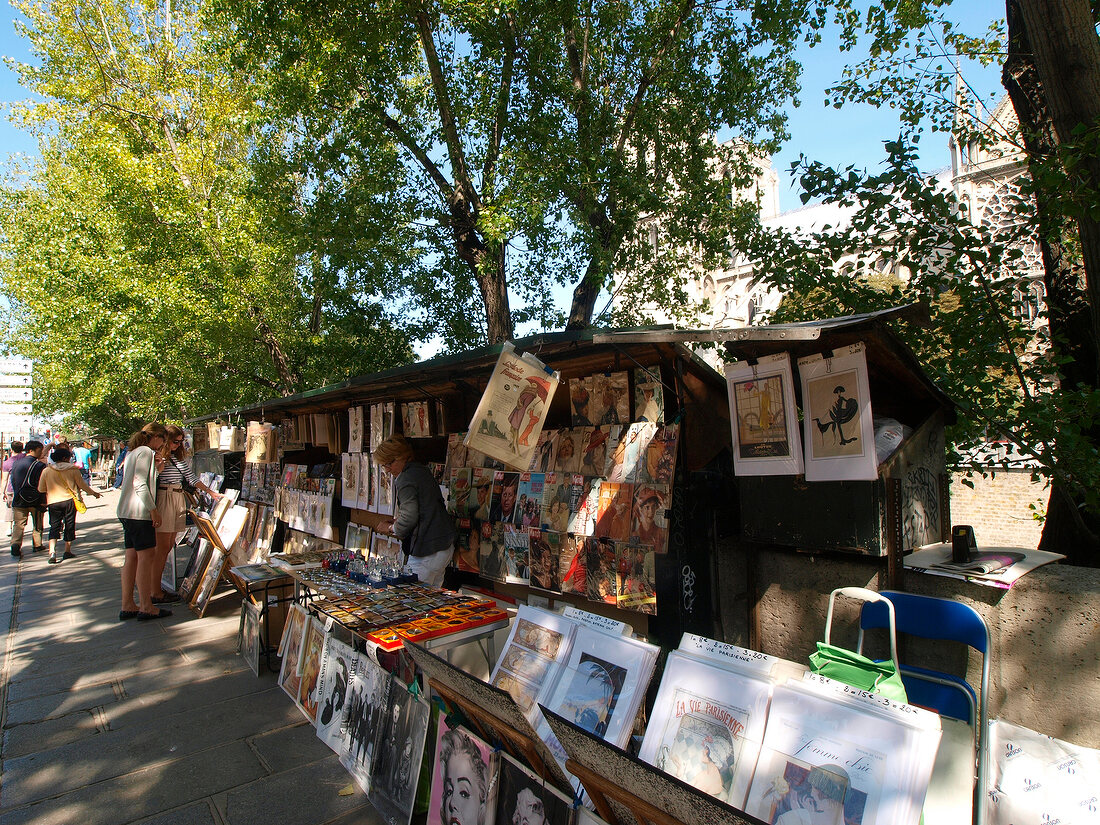 People buying paintings on street in Paris, France
