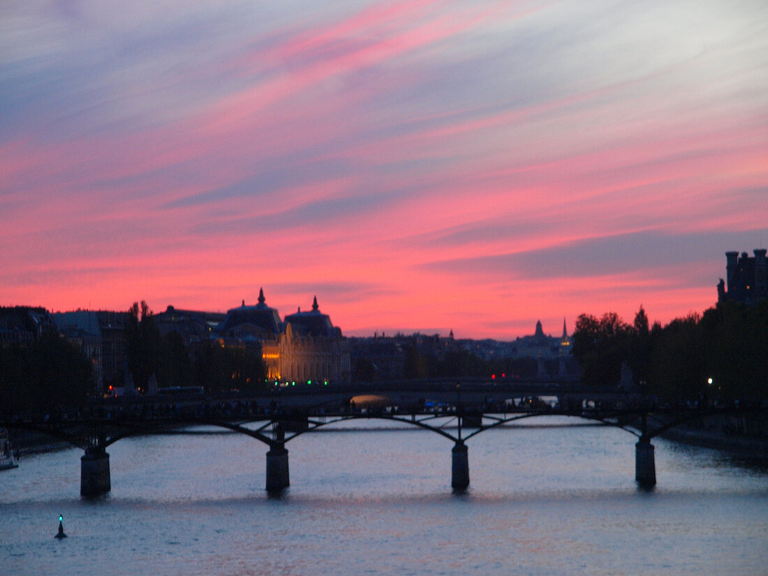 View of Pont des Arts at dusk in Paris, France