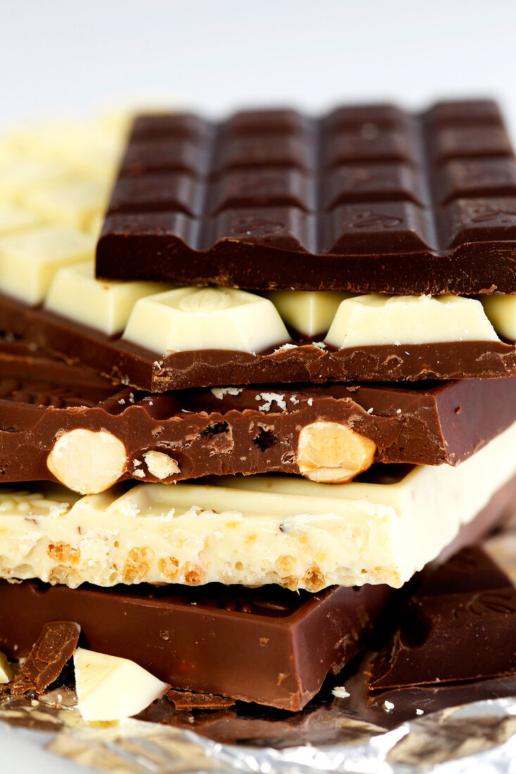 Close-up of pieces of various chocolate bars