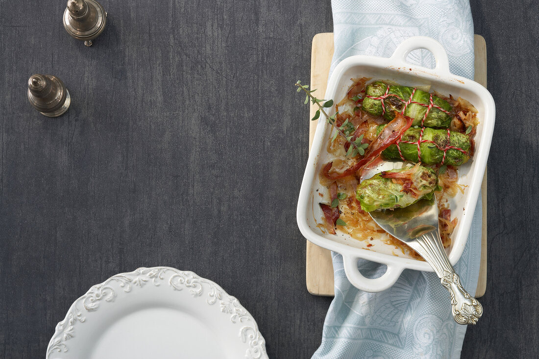 Stuffed cabbage with marjoram and bacon in serving bowl