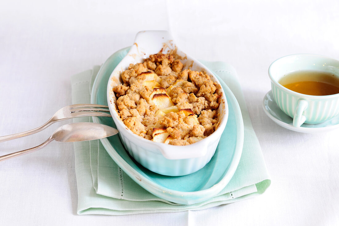 Apple and hazelnut crumble in serving dish