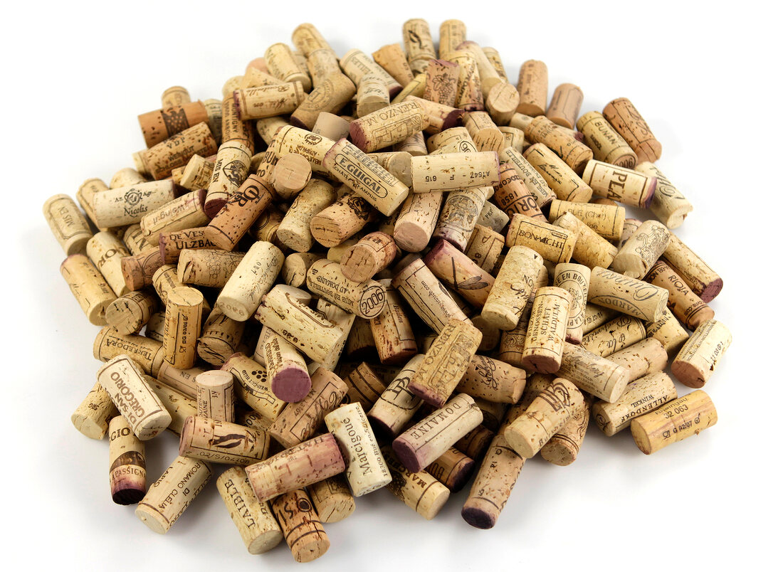 Several corks in pile on white background