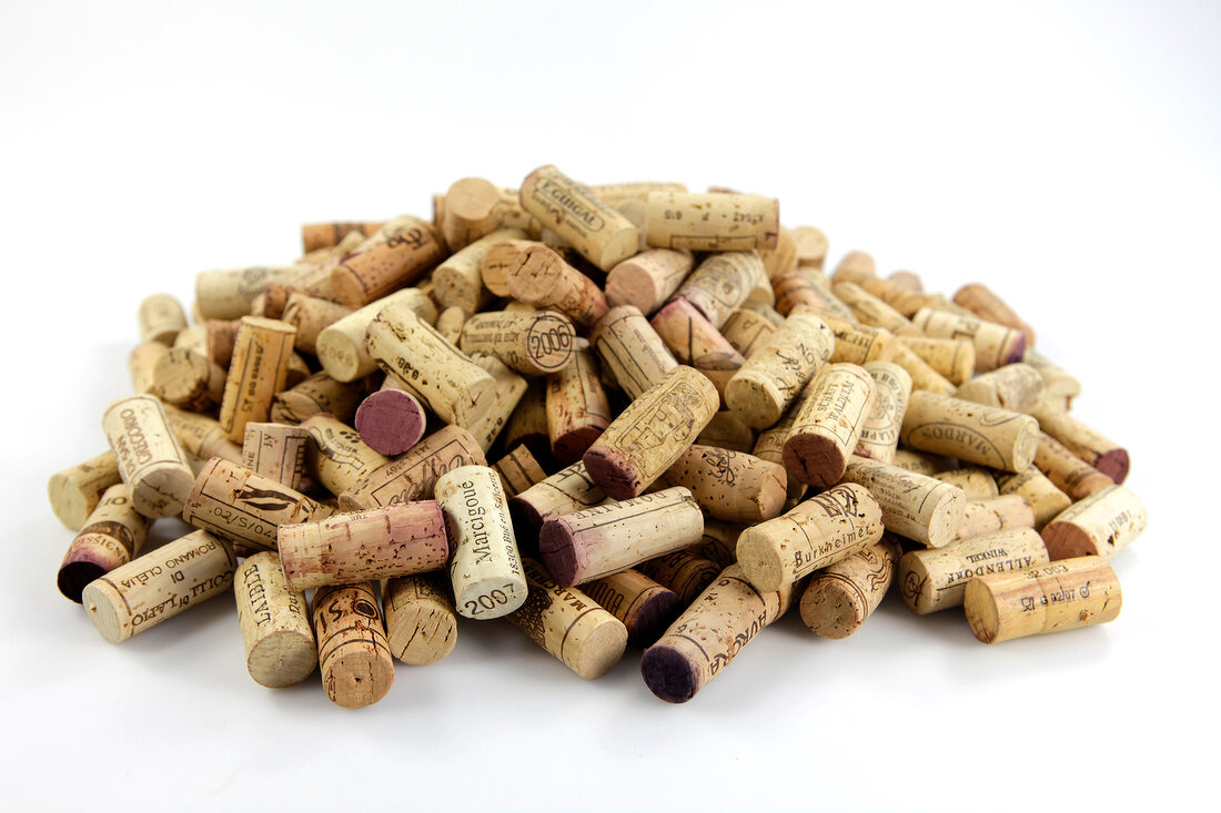 Several corks in pile on white background