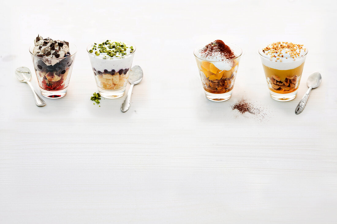 Four different type of trifle on white background