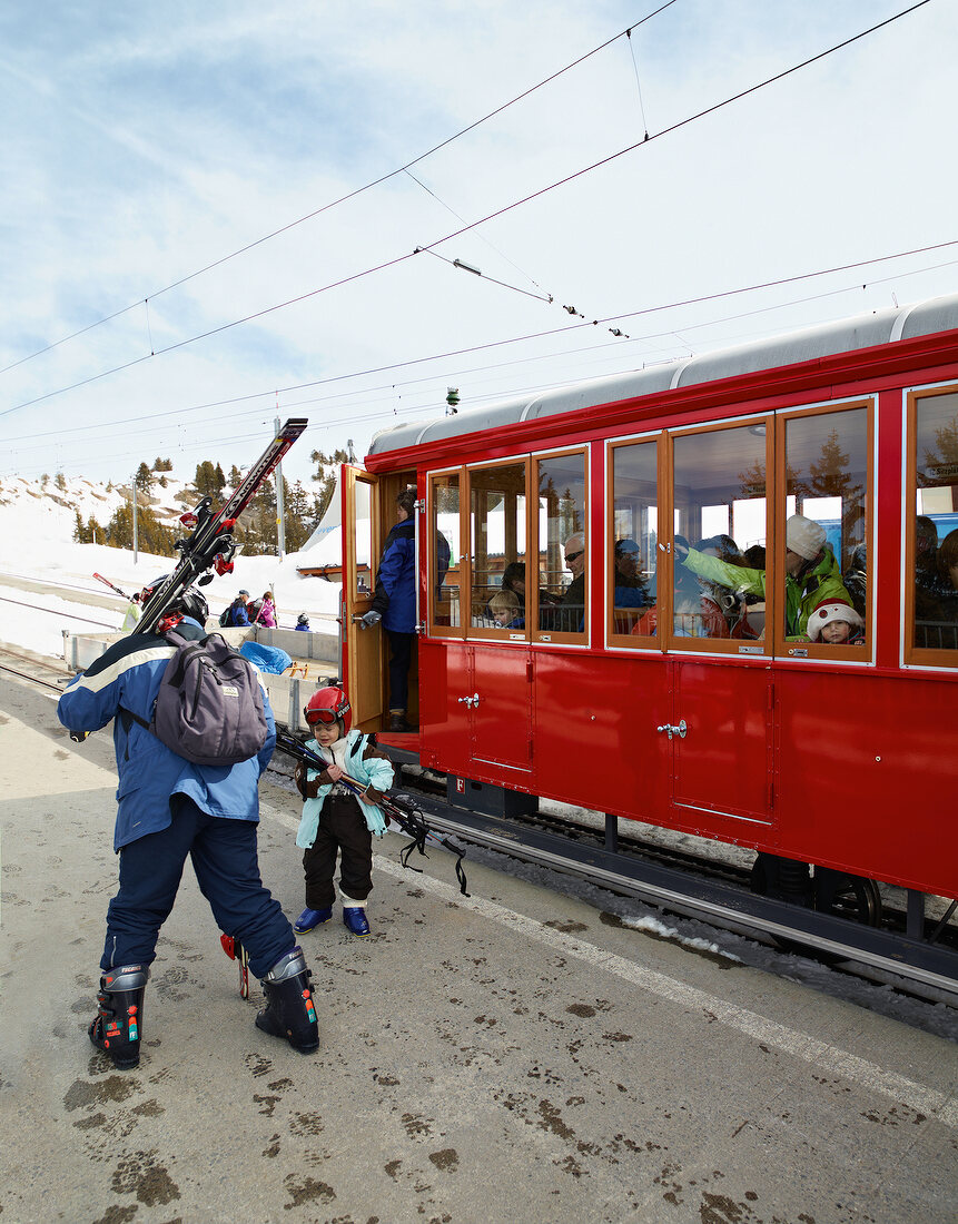 People in train on Vitznau Rigi Railway, Mount Rigi, Alps, Lucerne, Switzerland