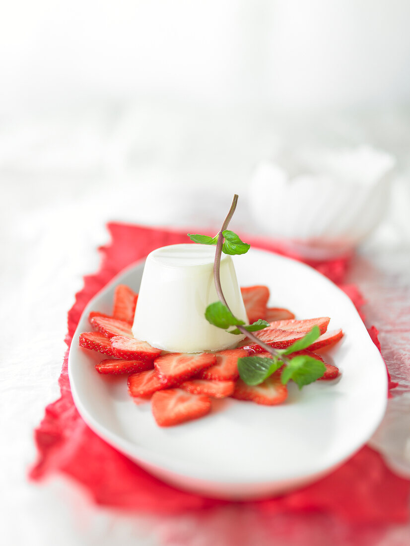 Mint panna cotta with strawberry salad on plate